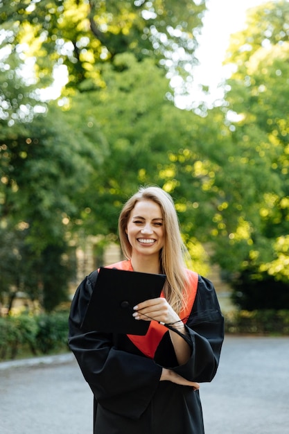 University graduate in a black gown The student completed university and obtained a masters degree