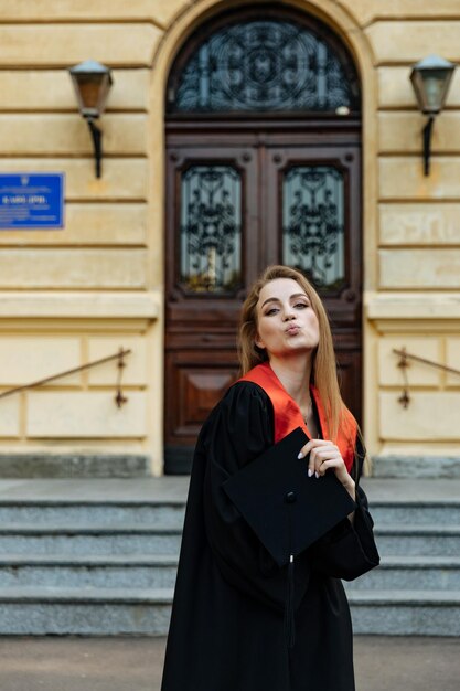 University graduate in a black gown The student completed university and obtained a masters degree