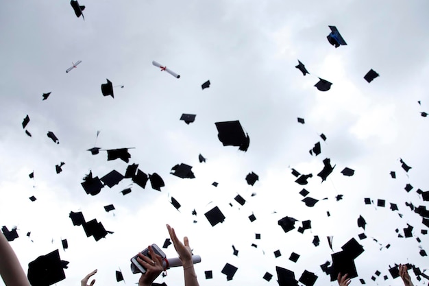 University graduation ceremony caps flying in the air