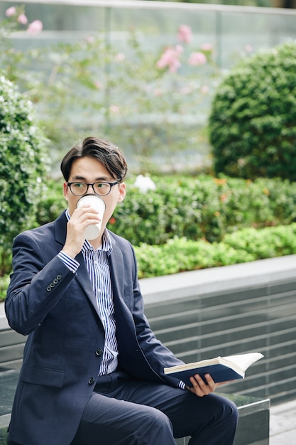 University student drinking coffee