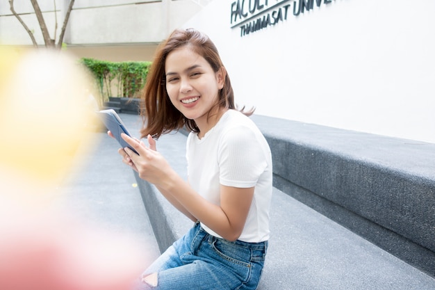 University student is holding tablet 