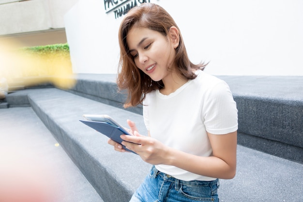 University student is holding tablet 