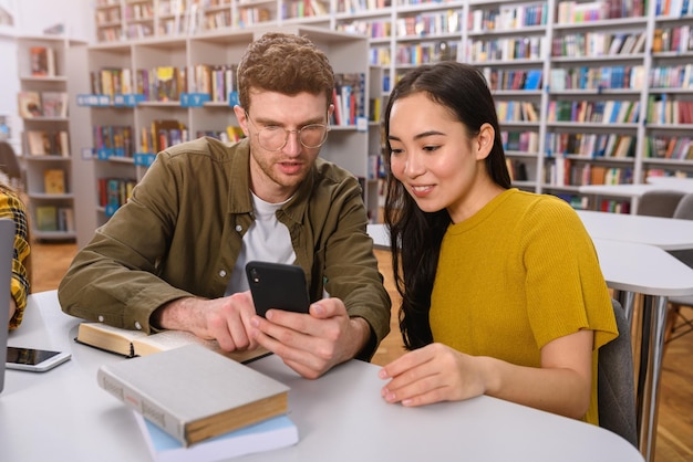 University students are studying in a library together as teamwork for preparation