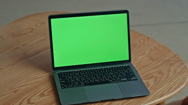 Unknown businessman using mockup laptop for video conference at office closeup