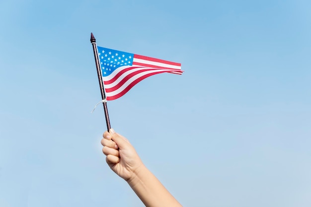 Unknown child waving an American flag