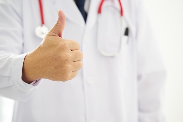 Unknown doctor hands with thumbs up