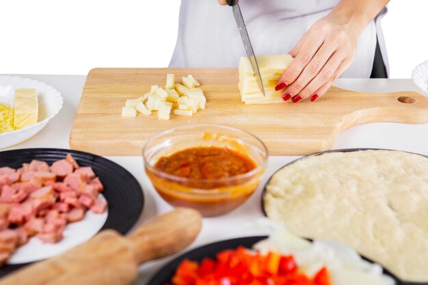 Unknown female chef slicing mozzarella