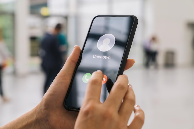 Photo unknown number calling in the ctiy. phone call from stranger. person holding mobile and smartphone at a trade fair. unexpected call disturbs at business conference.