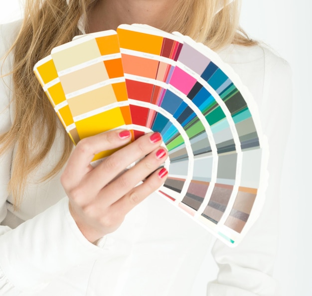 Unknown woman displaying a color swatch sampler