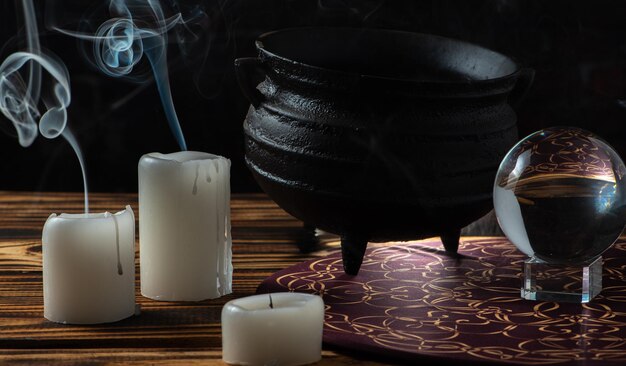 unlit candles scene with various objects and recently extinguished candles selective focus