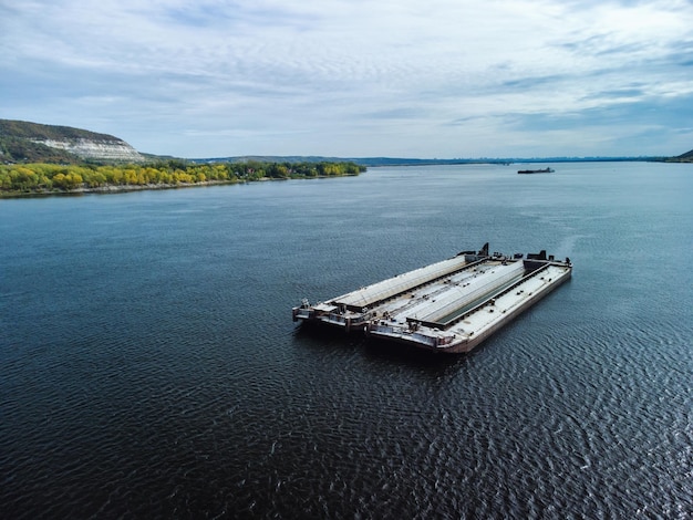 Unloaded barge awaiting pushboat on river