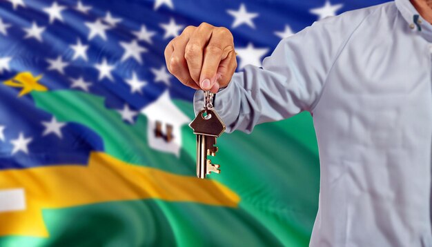 Unlock Your Dreams Free Photo of a Hand Giving Key to a Real Estate Agent Embrace the Journey