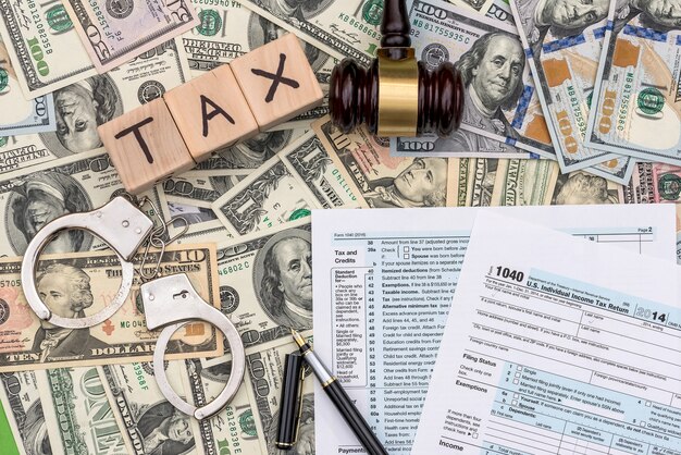 Photo unpaid taxes and punishment concept on dollar background