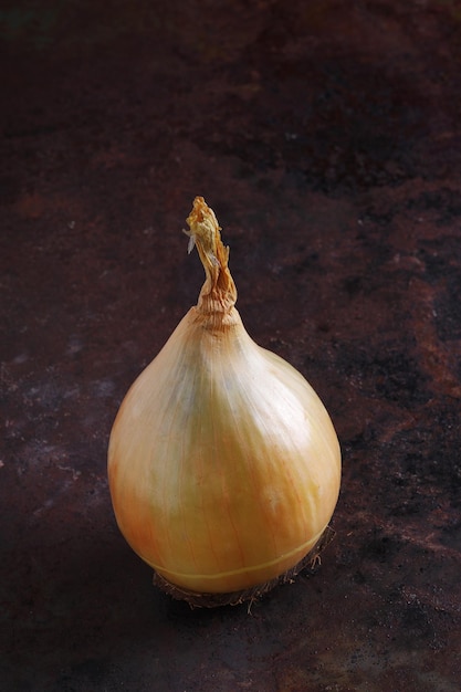 Unpeeled raw onion