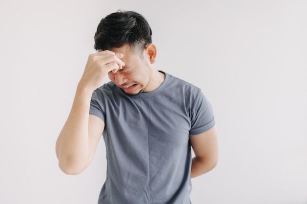 unpleasant feeling emotion of asian man isolated on white depressed and stress