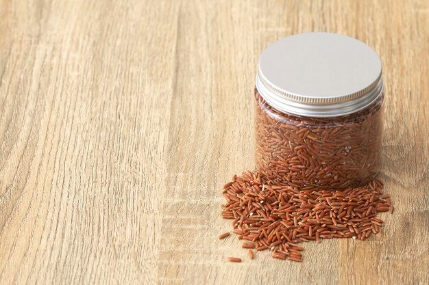 Unpolished red rice on white background. Product of Asia.