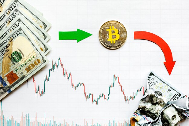 Unprofitable investment of depreciation of virtual money bitcoin Green red arrow silver bitcoin and dollars go down on forex paper Money turned to ash Concept of depreciation of cryptocurrency