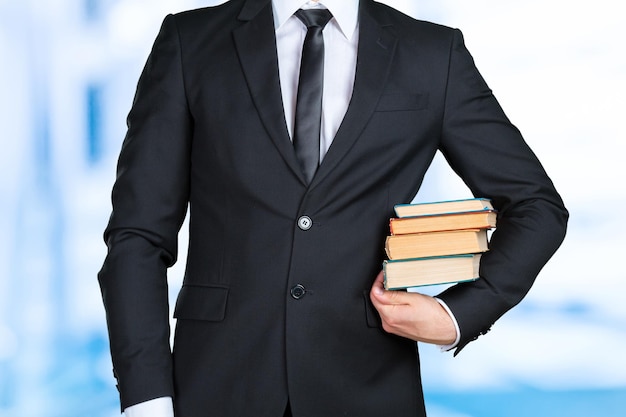 Photo unrecognizable businessman holding a book closeup