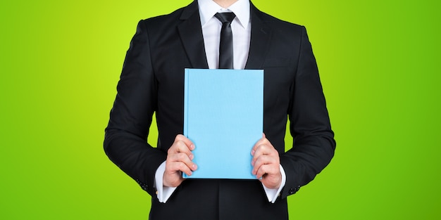 Unrecognizable businessman holding  a book