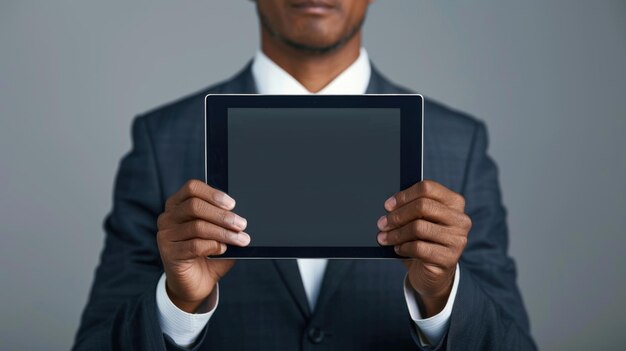 Unrecognizable businessman holding tablet with blank screen