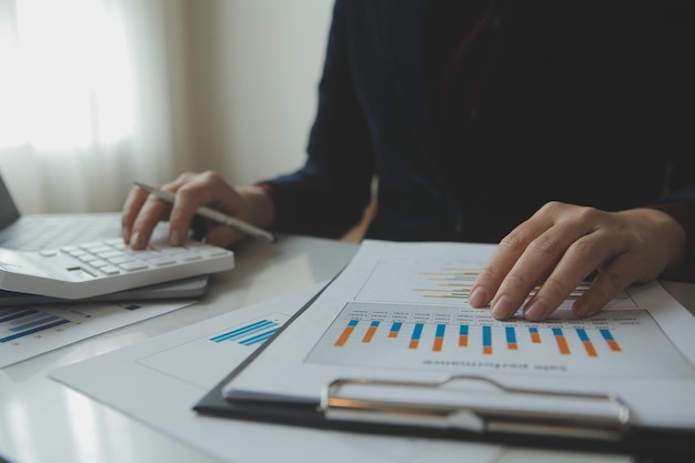 Unrecognizable businessman using calculator