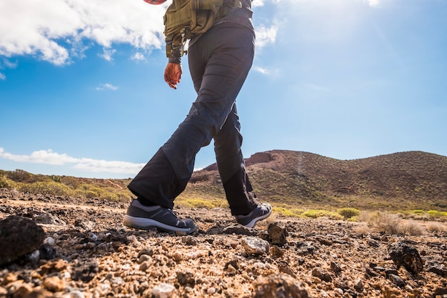 Unrecognizable people lady doing trekking outdoor sport activity in the mountains viewed from back 