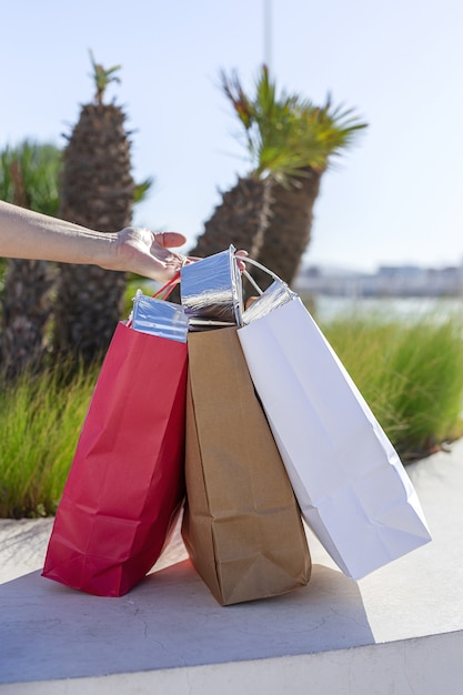 Unrecognizable woman carrying recyclable paper take away food bag