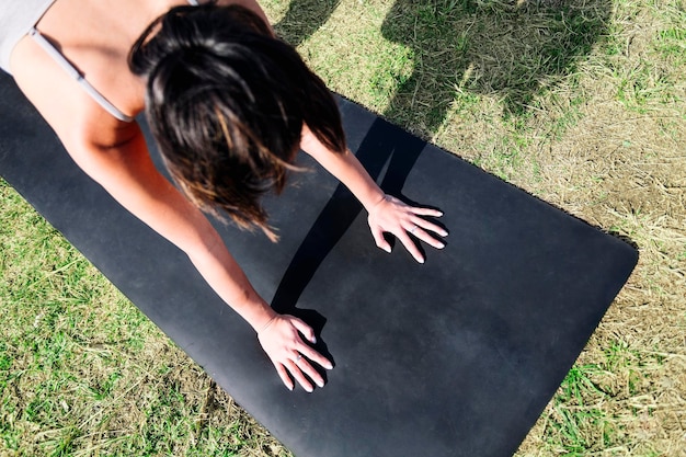 Unrecognizable woman does yoga stretching exercise