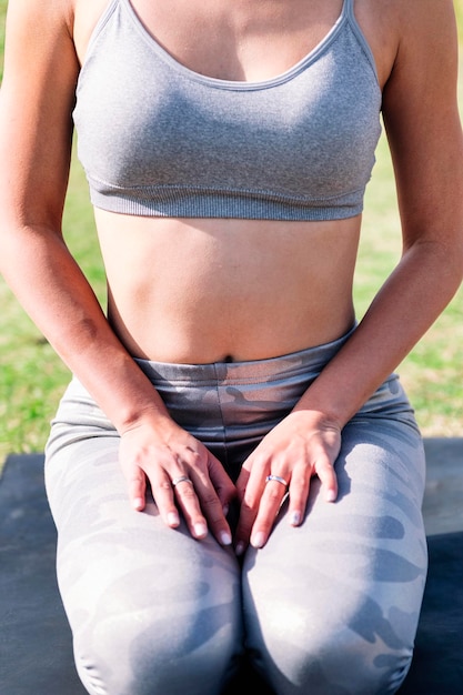 Unrecognizable woman doing relaxation exercises