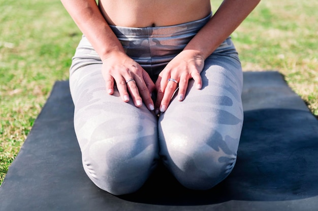 Unrecognizable woman doing relaxation exercises