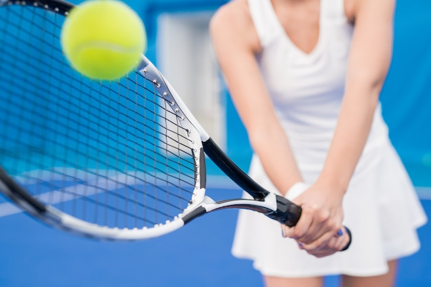 Unrecognizable Woman Playing Tennis