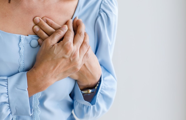 Photo unrecognizable woman with sudden heart attack and hold chest. concept of emergency health care and affected from congestive failure or cardiopulmonary resuscitation, heart problem.