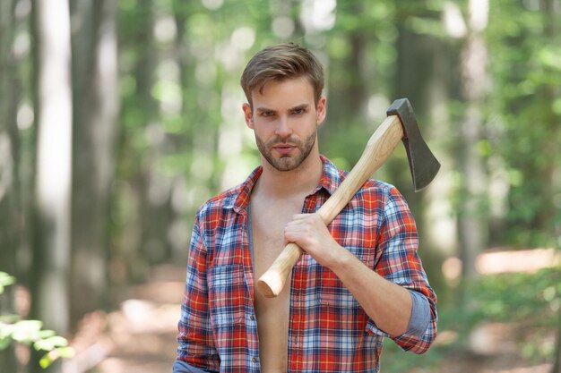 The Lumberjack Is Cutting Wood Or Firewood With Axe Outdoors. Stock Photo,  Picture and Royalty Free Image. Image 97231743.