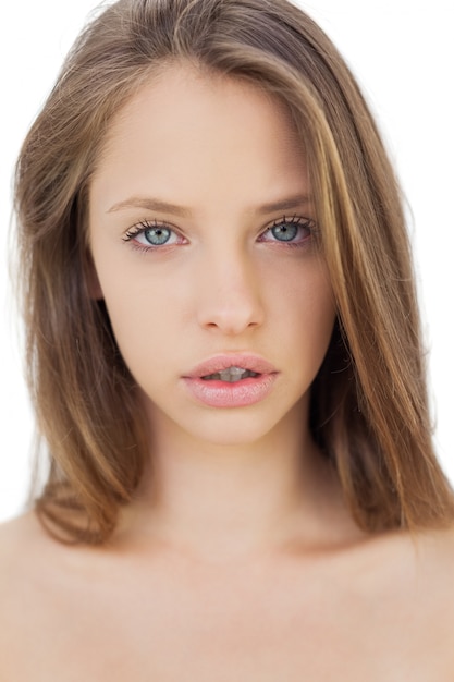 Unsmiling brunette model looking at camera