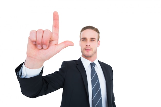 Unsmiling businessman in suit pointing up his finger