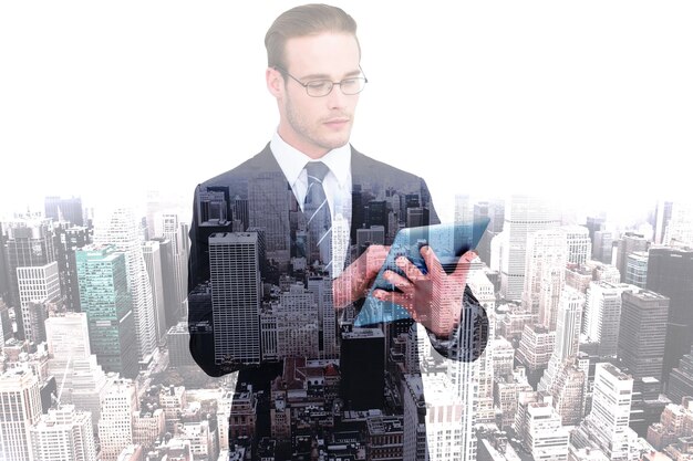 Unsmiling businessman using tablet pc against high angle view of city