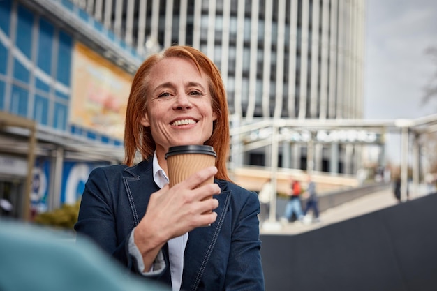 Unstoppable middleaged businesswoman fueling her success with coffee togo taking charge