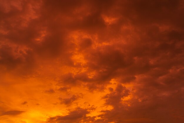 Unusually beautiful fiery red tropical sunset. Burning clouds. Fire in the sky