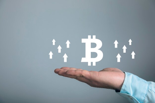 Up arrow bitcoin icon Rate growth Man holding in his hand