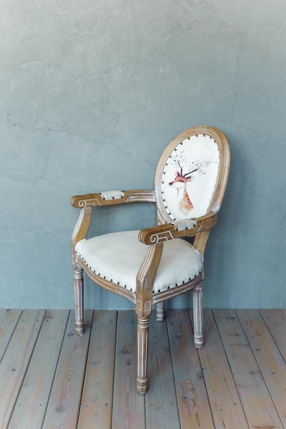 Photo upholstered french chair isolated on a gray background white armchair with natural oak armrests