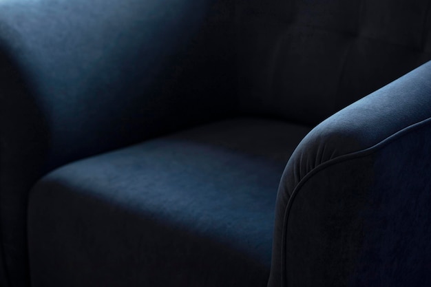 Upholstered furniture made of velor blue fabric with rounded elbows