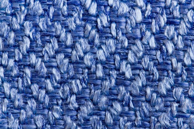 Photo upholstery fabric of a matting for furniture in large knitting from bright blue threads in macro