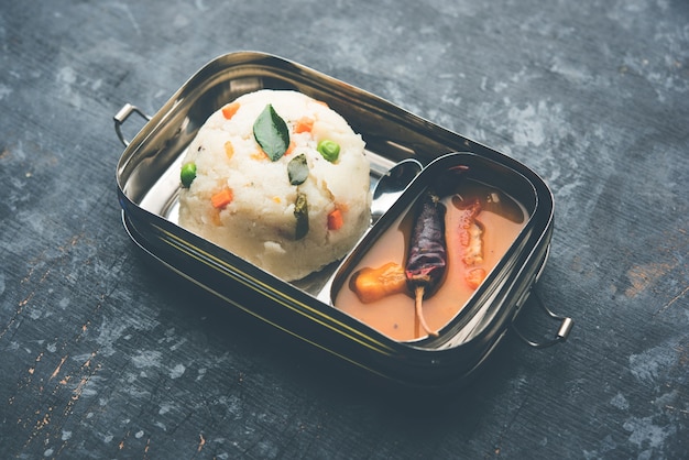 Upma  Sambar in Lunch Box of stainless steel, selective focus