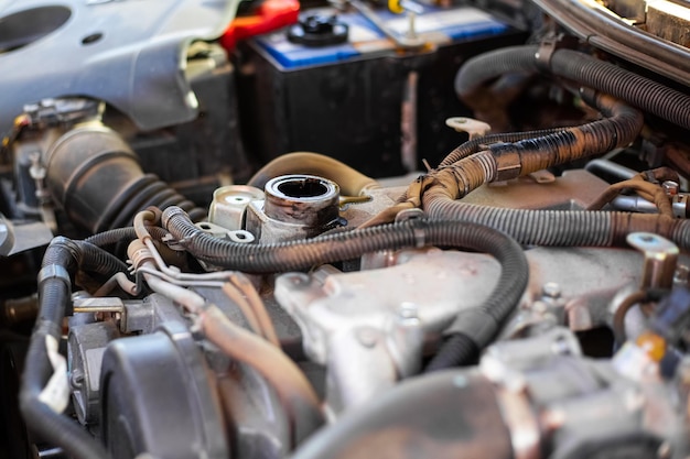 The upper part of the car engine with an open neck for pouring oil Changing the oil in the engine