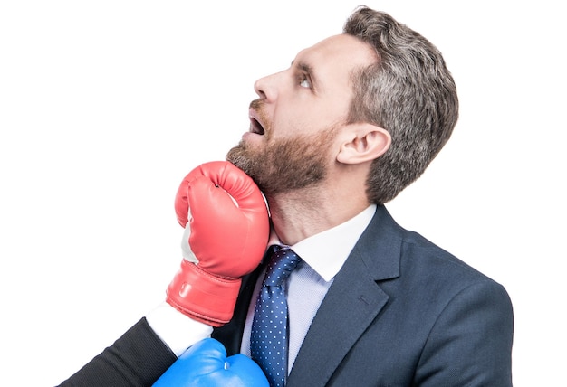 An uppercut crashes into his jaw. Businessman got punch in face. Knockout punch