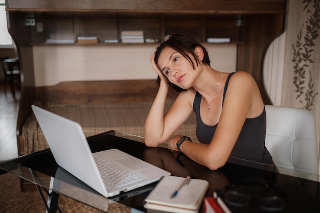 Upset asian woman working from home office