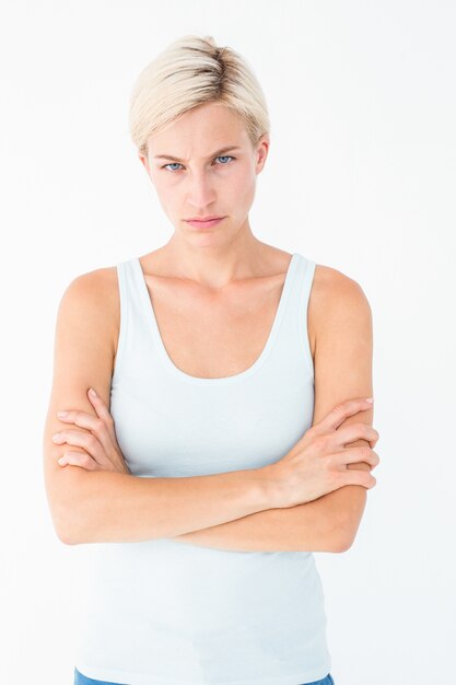 Upset blonde looking at camera with arms crossed 