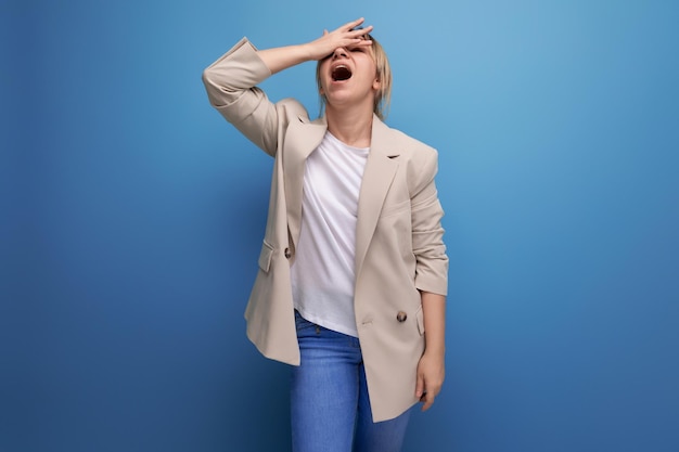 Upset blonde young adult in studio