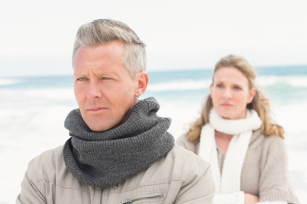 Upset couple look away from each other