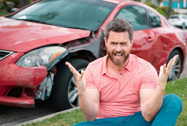 Photo upset driver man in front of automobile crash car collision accident